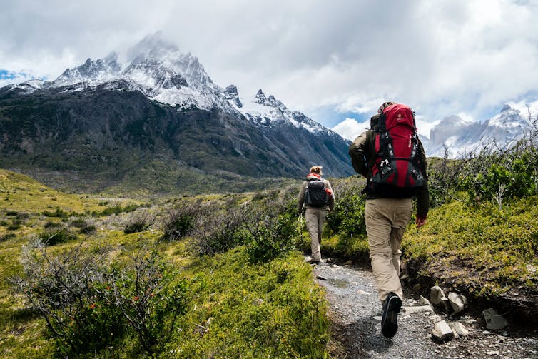 Two hikers on mountain trail