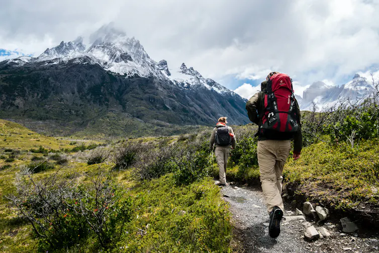 Two hikers on mountain trail