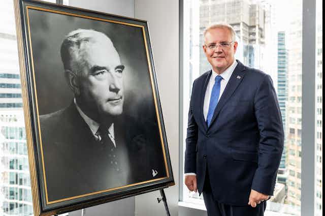 Prime Minister Scott Morrison stands in front of a portrait of his Liberal predecessor Robert Menzies