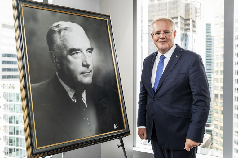 Prime Minister Scott Morrison stands in front of a portrait of his Liberal predecessor Robert Menzies