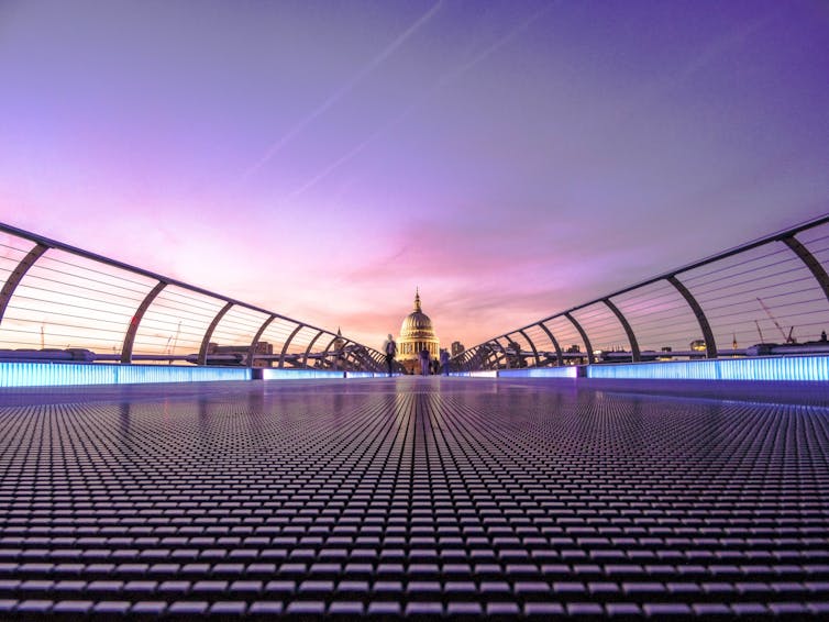 View over Millennium Bridge in London at dusk