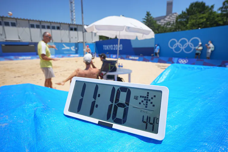 A thermometre shows 44C at 11am on a beach volleyball practice court in Tokyo