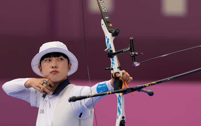 South Korea's An San looks at her bow during her individual elimination match at the Summer Olympics, 