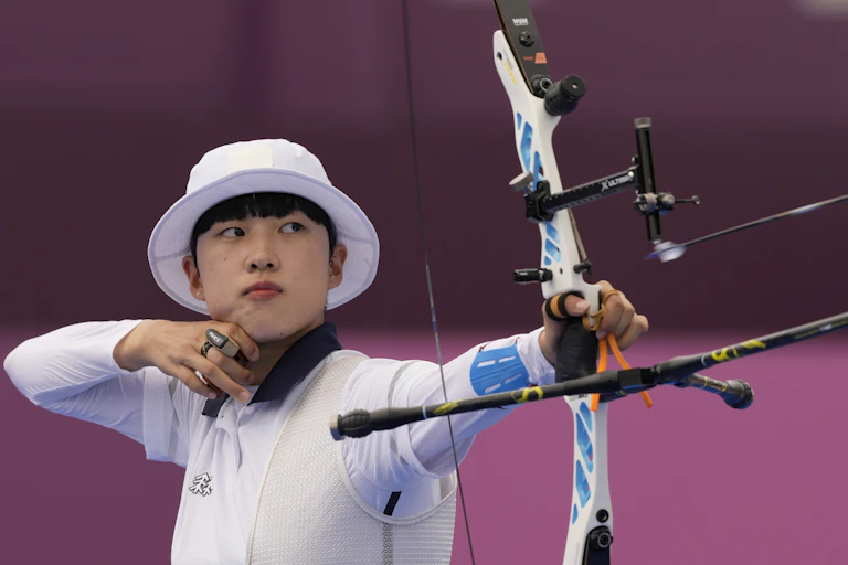 South Korea's An San looks at her bow during her individual elimination match at the Summer Olympics,