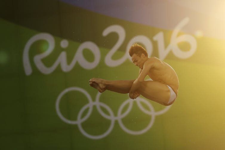 Tom Daley captured mid-dive at a 2016 Rio Olympics event.