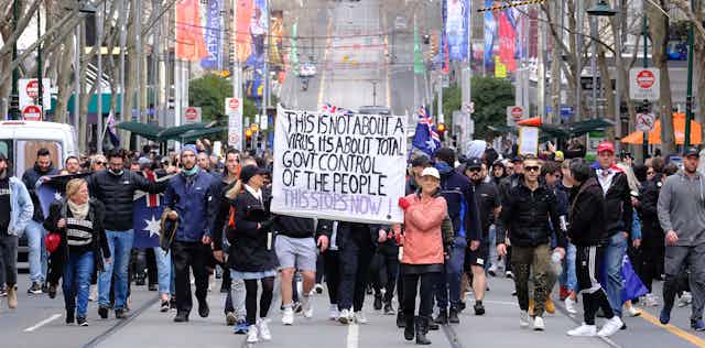 Protesters opposed to lockdowns, masks, the media and government in Melbourne, Saturday, July 24 2021.
