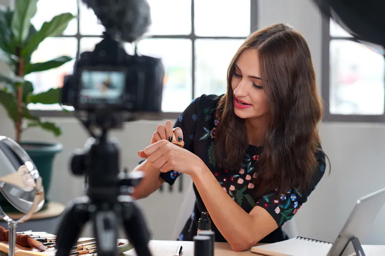 Beauty vlogger being filmed.