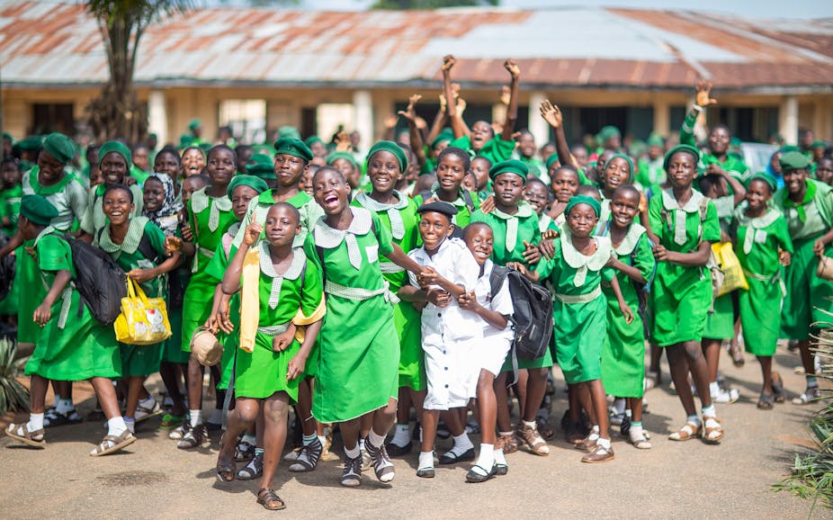 Students of the Islamic Girl's High School cheer during the arrival of German Minister of Economic Cooperation and Development, Gerd Mueller (CSU) near Abeokuta, Nigeria, 11 June 2014