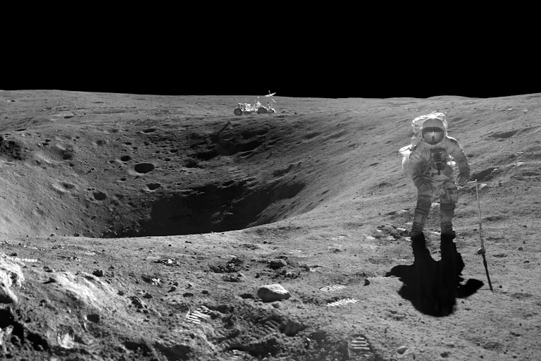 An astronaut walking on the moon with a lunar rover in the background.