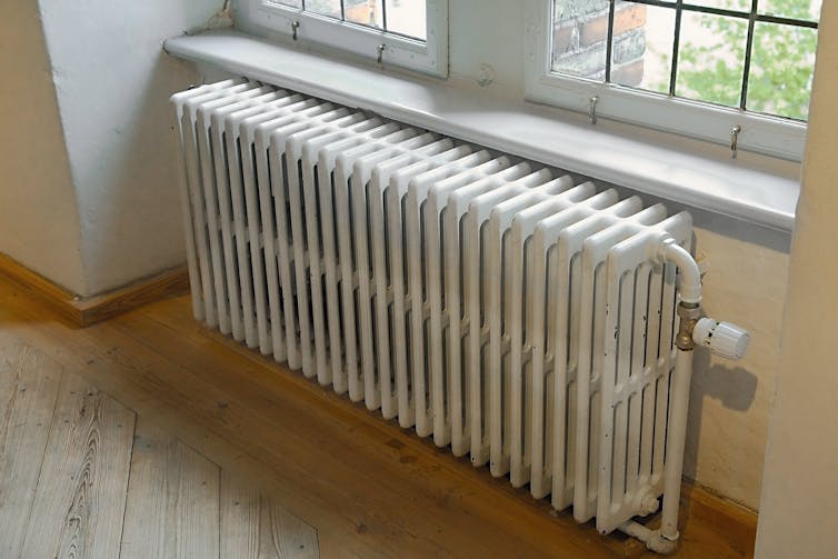 Old radiator against a wall