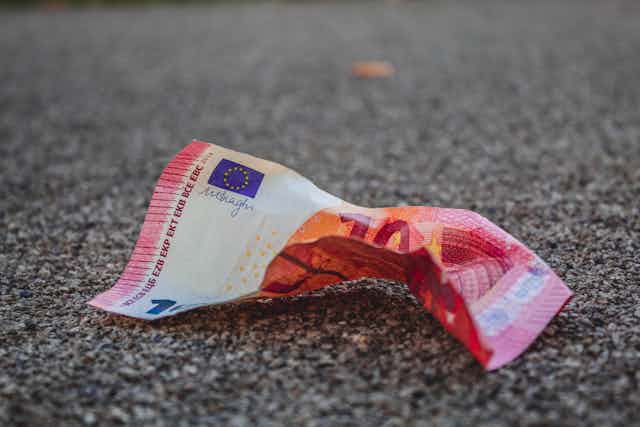 Crumpled up ten euro note