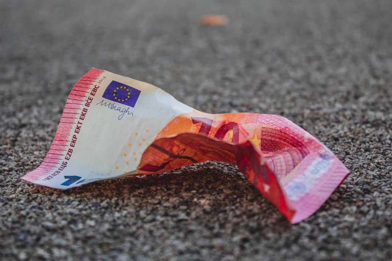 Crumpled up ten euro note
