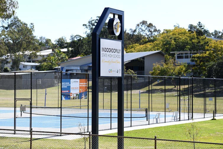 View of high school buildings and tennis courts