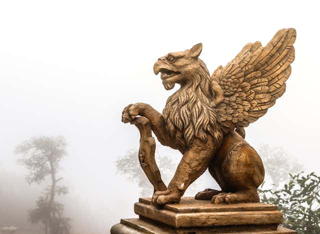 stature of a griffin with the body of a lion, the head and wings of an eagle