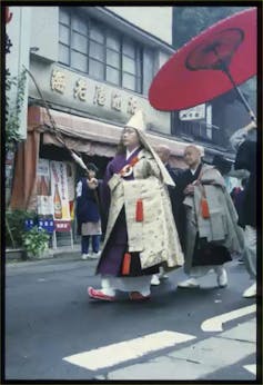 Shinto priests in purification ceremony/festival in Yokohama.