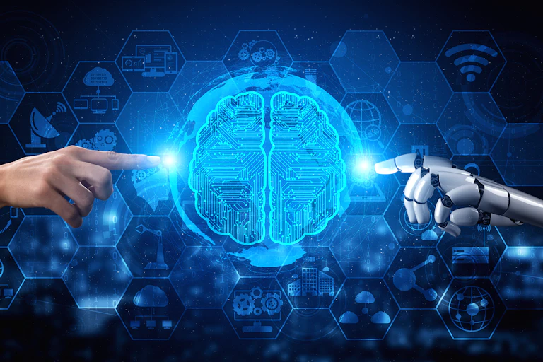 A human hand reaches for a lit-up illustration of a human brain while a robotic hand does the same from the other side of the image.