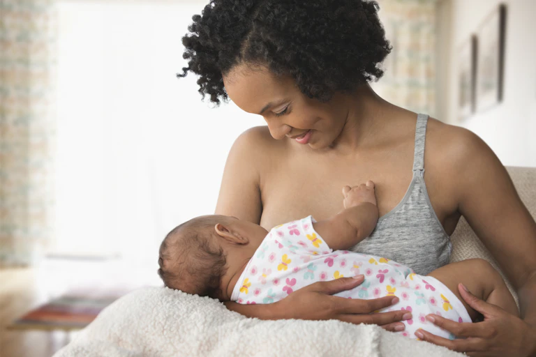Woman breastfeeding baby