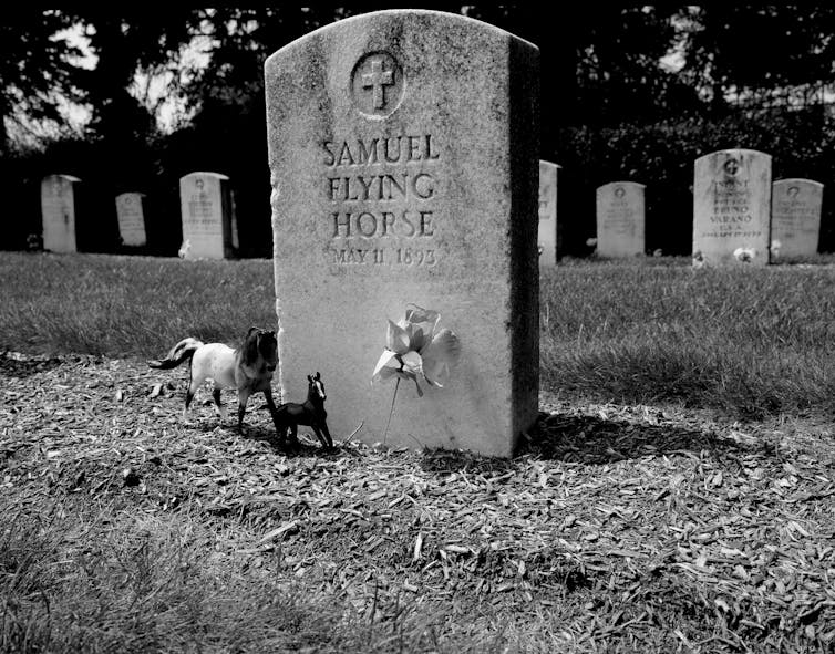 A tombstone for Samuel Flying Horse, who died May 11, 1893.