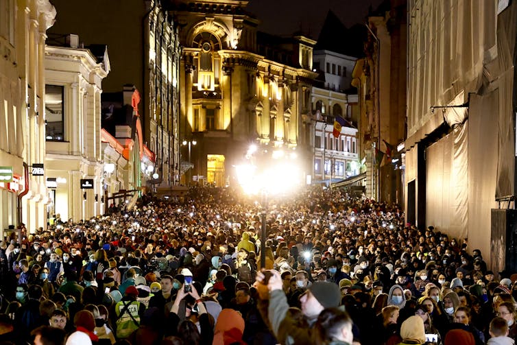 Huge crowd in a city street at night