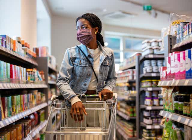 Female shopper with face mask at grocery store