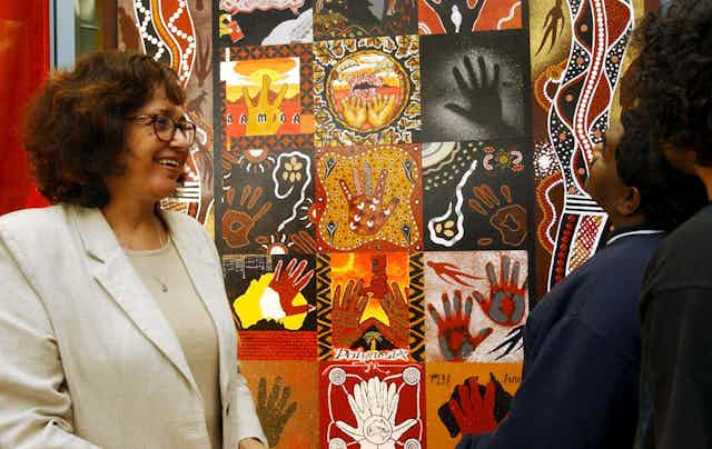 Aboriginal elder Joy Murphy attending the unveiling of a mural painted by Indigenous people in prison.