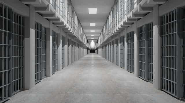 Image of rows of prison cells.