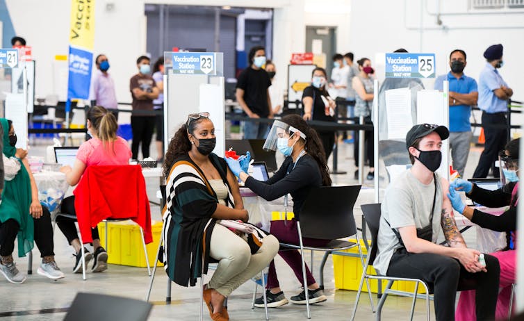 People getting vaccinated at a clinic.