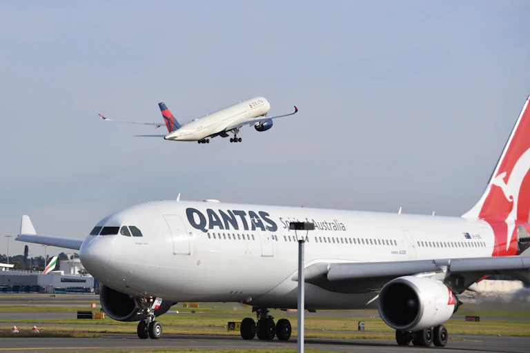 A Delta airlines plane takes to the sky over Sydney airport.