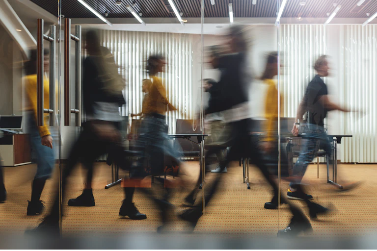 workers moving in modern office