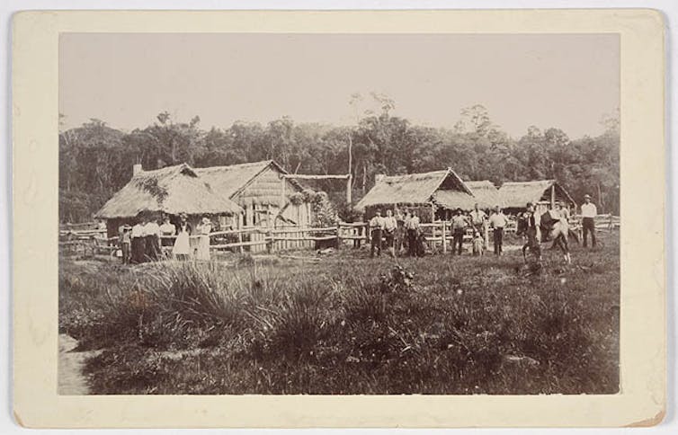 black and white photo of huts