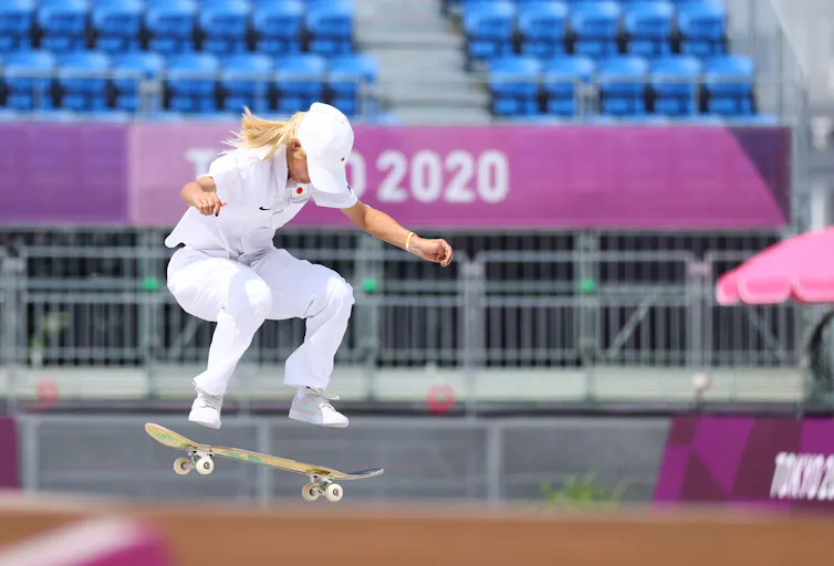 Skatboarder in all white.