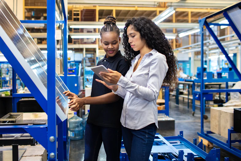 two women working together in a warehouse
