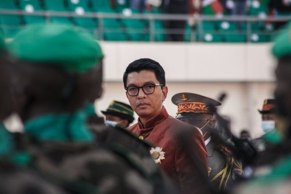 Madagascar's President Andry Rajoelina inspects the troops during the Independence Day celebration at the brand new Barea Stadium in Antananarivo on June 26, 2021.
