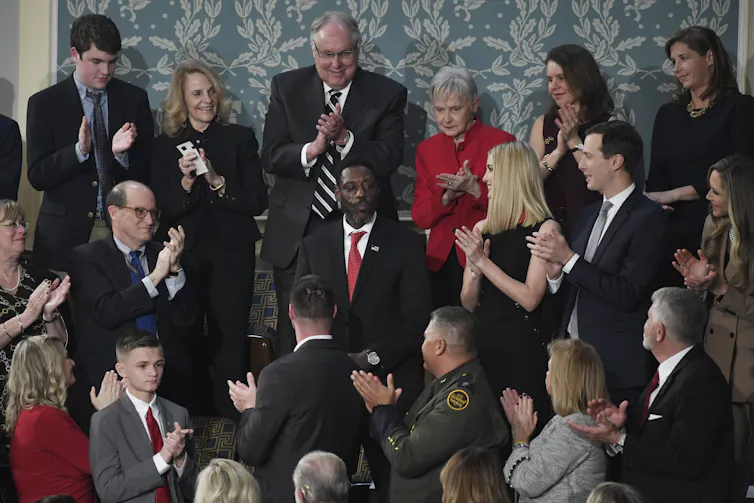 A man receives a standing ovation.
