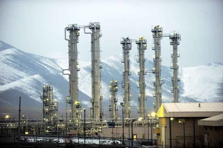 Iranian heavy water plant in Arak, set against a background of mountains.