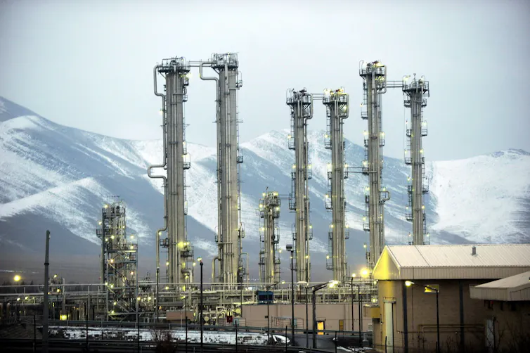 Iranian heavy water plant in Arak, set against a background of mountains.