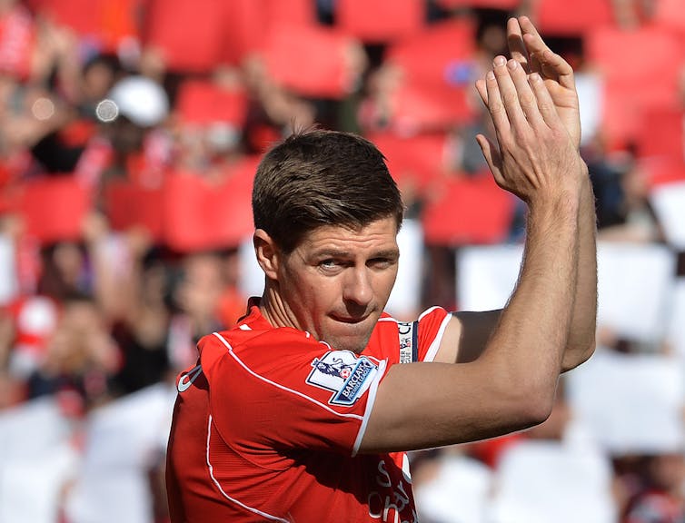 Steven Gerrard clapping on the pitch for Liverpool