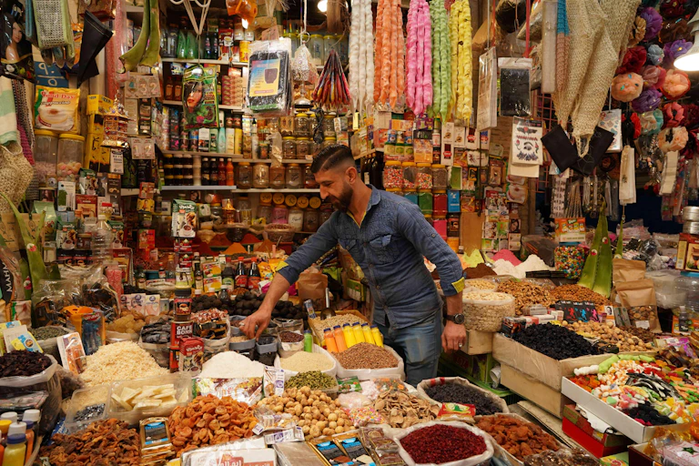 A spice merchant in his shop in Bab Al-Saray market during Ramadan in April 2021