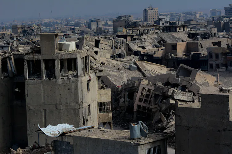 A cityscape of ruined buildings and rubble