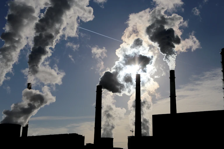smoke billows from stacks