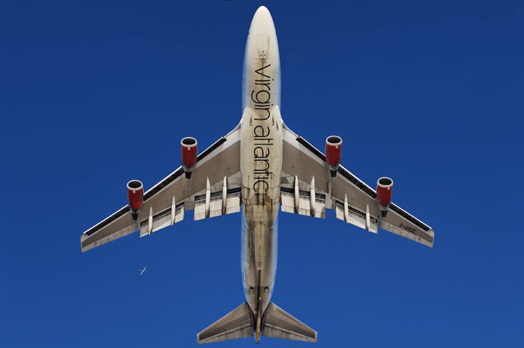 A Virgin Atlantic plane viewed from below