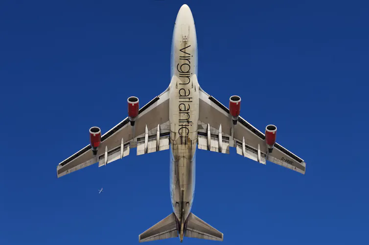 A Virgin Atlantic plane viewed from below