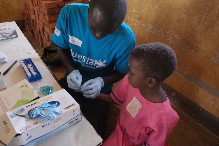 A child getting tested for malaria