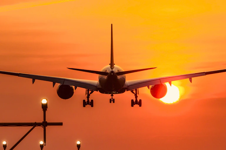 Plane in sun set