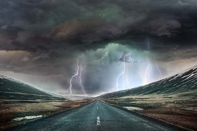 A stormy landscape above a road