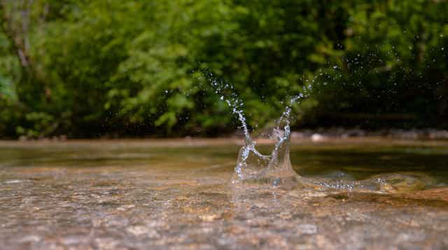 Splash in clear river water.