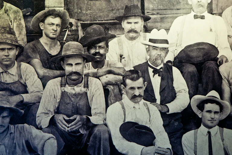 A group of men pose in an 1870 photograph.