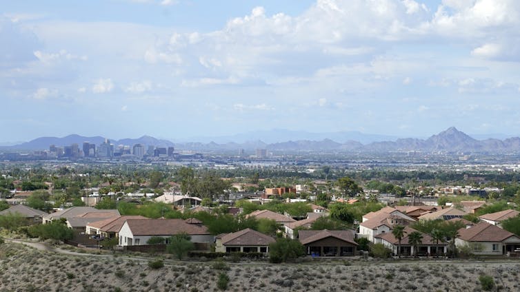 Downtown Phoenix with suburban homes in foreground.