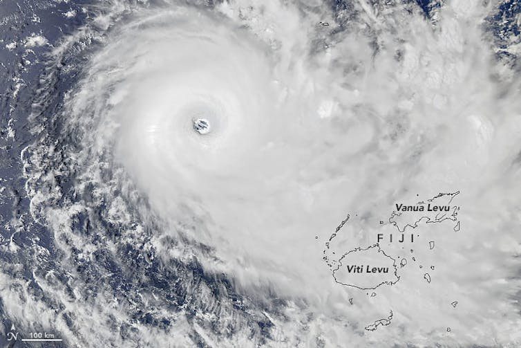 Satellite view of a hurricane with outlines of the islands in its path