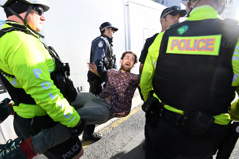 An Extinction Rebellion protester is arrested in 2019.